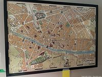 Framed map of Florence showing detailed city layout and landmarks.