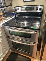 Front view showing full stove including cooktop and double ovens