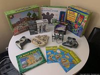 Full view of all items including drones, kits, puzzle, and games arranged on a circular white table.