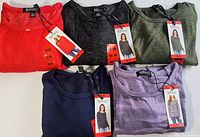 Five Buffalo David Bitton ladies long sleeve knit tops in assorted colors, neatly folded with tags visible.
