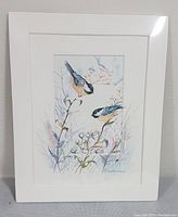 Photo of factory sealed framed watercolour by Madu Masco showing two birds on branches with muted natural colors and signed by artist.
