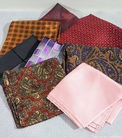 Photo showing all eight vintage pocket squares in various colors and patterns.
