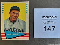 Single card close-up of Rogers Hornsby with yellow background and clean edges.