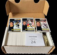 Box containing the complete set of 420 cards with three sample cards (Mario Lemieux, Wayne Gretzky, Patrick Roy) laid on top.
