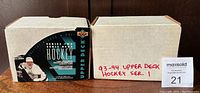 Two white boxes labeled for 1993-94 Upper Deck Hockey Series 1 and 2 holding full card sets