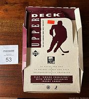 Outer partial wax box with hockey silhouette and 36 packs originally per box printed, shows wear and tear.