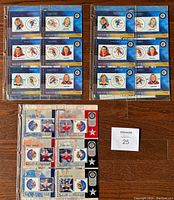 Two 2001 and one 2002 NHL All Star Game collectible sets in custom plastic holders. Each set includes stamps and corresponding hard plastic cards featuring classic NHL players.