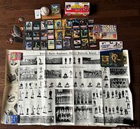 Photo showing entire lot laid out on floor including box, cards, figure, baseball, poster.