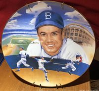 Front view of the round collector plate showing Duke Snider's portrait, action scenes, and autograph in gold Sharpie.