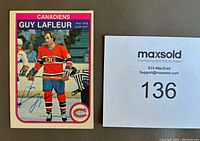 Front view of the hockey card showing Guy Lafleur in Montreal Canadiens uniform signed in ballpoint pen next to MaxSold card number paper.
