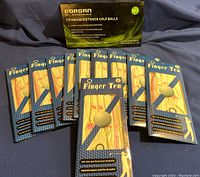 10 new Finger Ten golf gloves sealed in original packaging, size large, white with pink details