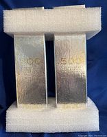 Two silver U.S. Mint boxes with foam separators, each stamped “500”