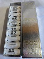 Metal display box containing ten paper-wrapped coin rolls, each labeled '25 Twenty-Five Nickels of the United States of America, Uncirculated, Denver Mint'.