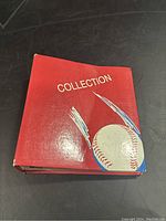 Red binder album cover with 'Collection' text and baseball graphic.