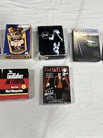 Front view of all 5 boxed sets/DVDs including Mr. Bean, 24 Season Two, Six Feet Under, The Godfather Returns audiobook, and Red Skelton 10 episodes.