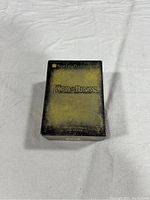 Front view of Lord of the Rings trilogy box set with distinct green colored slipcase for Fellowship of the Ring visible.