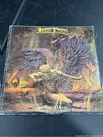 Front cover of Judas Priest Sad Wings Of Destiny vinyl album showing detailed angelic artwork.