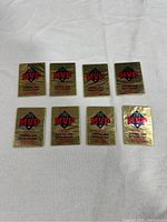 Eight sealed 1992 Donruss McDonald's MVP baseball card packs arranged in two rows of four on a white fabric surface.