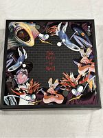 Front face of the box showing colorful artwork and Pink Floyd The Wall branding