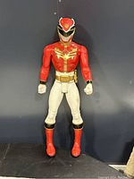Front full view of 31 inch Power Rangers Mega Force Red Ranger action figure showing full body in red, white, gold, and black color scheme.