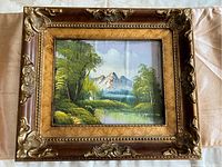 Full view of oil painting in large ornate brown and gold wooden frame.