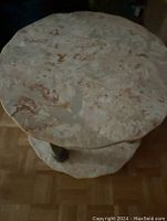 Top view of round marble tabletop showing coloration and patterning