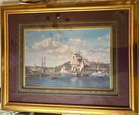 Full view of the framed sailboat print showing gold frame, matting, and print.