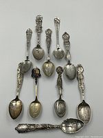 Close grouping of ten spoons front face up