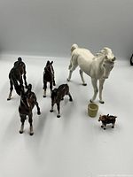 Group shot of all porcelain figurines on white background.