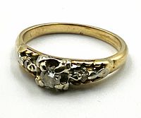 Front view of ring showing diamond and floral setting