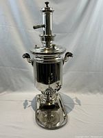 Front view of entire samovar on stand with tray