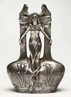 Front view of silver plated Art Nouveau vase sculpture on white background