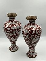 Pair of vases shown front-on against white background