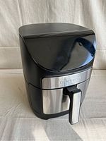 Front angled view of black and stainless steel Gourmia air fryer.