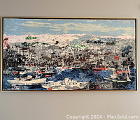 Full view of the framed painting hung on wall