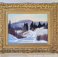 Front view of oil on board painting in ornate carved gilt frame showing winter landscape scene with snow, pines, and distant mountains