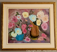 Full view of the framed oil painting with floral still life in vibrant colors.