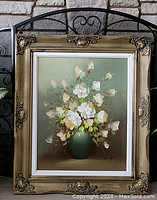 Frontal view of still life oil painting of white flowers in green vase, showing entire frame and artwork.