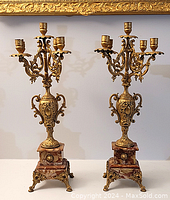 Overall view of both candelabra showing matching gilt metal arms and marble bases