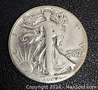Obverse side of 1942 Walking Liberty half dollar silver coin with Lady Liberty and rising sun design.