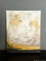 Front view of an abstract rectangular canvas painting with gold accents and cracked paint surface.