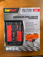 EverStart Smart Charger boxed in retail packaging showing brand, 2amp charging current, 7 stages of smart charging, and safety features