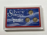 Front of plexiglass case showing the three silver Mercury dimes with their respective mint marks and identification labels: Philadelphia Mint, Denver Mint, San Francisco Mint.