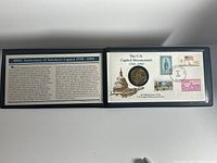 Photo of the open portfolio showing the U.S. Capitol Bicentennial commemorative coin and the information panel describing the 200th Anniversary of America's Capitol from 1789-1989.