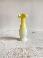 Front view of the satin glass vase showing full height and ruffled rim.