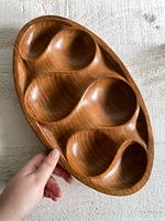 Top view of the vintage solid wood platter showing five rounded compartments clearly carved out.