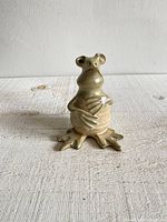 Front view of the vintage studio pottery frog figurine showing its upright stance and hands on belly.