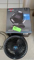 Vornado whole room circulator fan in box with fan outside box; black color.
