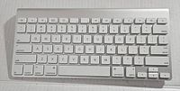 Top view of the Apple A1314 wireless keyboard showing all keys and overall condition.