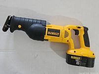 Full side profile of the Dewalt DC385 XRP 18V cordless reciprocating saw showing the yellow and black body, brand label, and battery attached.